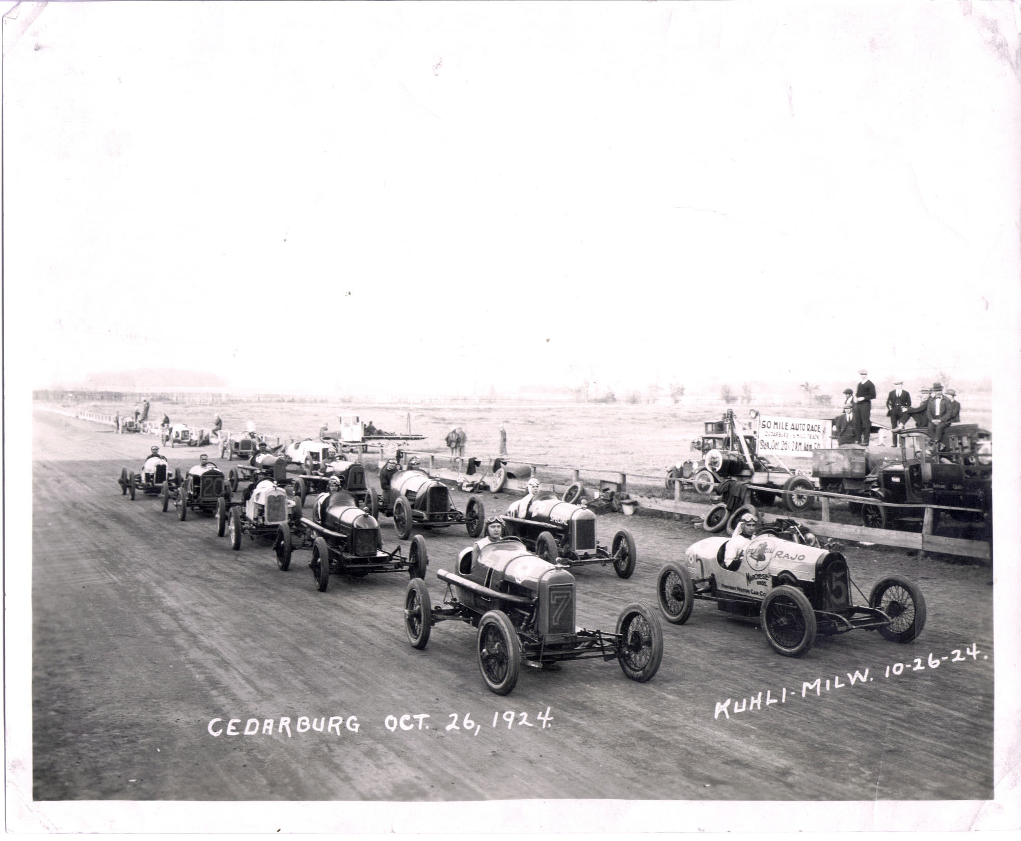 As dangerous as auto racing is today, races in the early days were even more so.  Note the unbanked dirt track and the open cockpit in these cars.  

That's my great, great Uncle Willie driving the Fronty Ford marked with a 7.  Apparently, he held a few local records on the 50-mile dirt track. This is from 1924 in Cedarburg, Wisconsin - a suburb of Milwaukee. View full size.